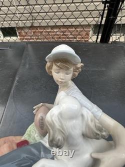 Vintage Nao by Lladro porcelain figurine titled Boy With Dog And Football 1985
